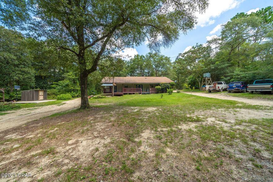 This four bedroom, two bathroom house sits on just over two acres. With two completely fenced pastures lots of opportunities for farm animals.  Main shop has a 16X24 full concrete slab, 220/110v power, over head lighting, 10' door opening, 8x16 loft. Secondary shop 8X12 insulated roof, climate controlled,  sitting on a 24X36 6'' thick concrete slab. Only a mile from a public boat ramp, and pine log state forest.