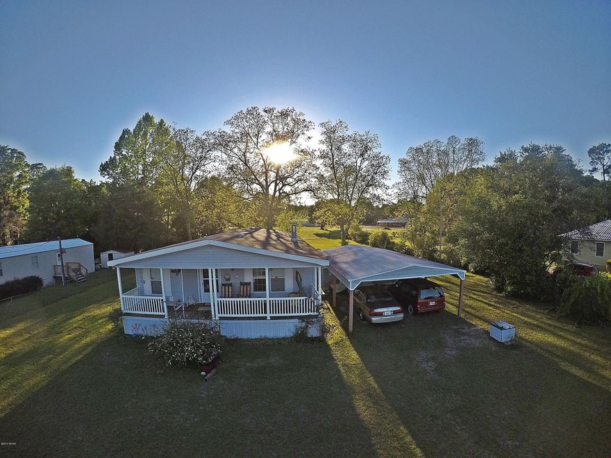 Well maintained  home in town, large living room with stone fireplace, kitchen has an abundance of cabinets,breakfast bar built in oven and microwave, side by side ref with ice and water in door, glass top built in stove, stainless sink, dishwasher, everything elec, 4 ton air, had county water and septic but also has well for garden. Large master bedroom  with large master bath with garden tub, double sinks and a walk in shower, lots of closet space yards are well kept, plenty of room for a garden, bearing pecan trees, a double car carport with a utility shed. There is a front porch for afternoon shade. This home is a must see.