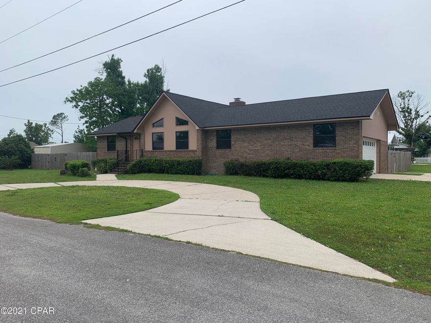 Completely remodeled custom home - 3 bedrooms - 2 baths - Corner lot - Brick home - desirable Lynn Haven.  Large living room with Cathedral Ceilings, fireplace, formal dining room, breakfast area in kitchen, & inside laundry room.  Porcelain tile throughout, new ceiling fans and new Anderson windows.  Large 2 car garage with new door and electric opener.  New architectural roof and gutters.  Large fenced yard and wood deck, sprinkler/irrigation system.  New A/C in 2019.  Kitchen & bathrooms are updated with granite, new tile, vanities, sinks & fixtures.  New Frigidaire Gallery appliances/custom kitchen cabinets. Quiet and safe neighborhood - 3 block walk to A.L. Kinsaul Park and nearby Leslie Porter Park. Low flood insurance.