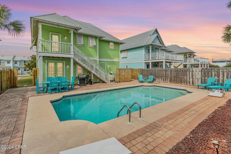 Motivated seller! Discover the perfect coastal beach retreat in this beautifully updated East End pool home 2 blocks from the beach near Schooners. This classic beach home features an open floor plan with high ceilings making it a perfect space for hosting large families. You'll be the envy of your neighbors with great curb appeal on your bright beachy home with hardie board siding. The outdoor space will be a central focus with a stunning pool surrounded by polywood furniture. Inside you'll find hardwood floors, custom tile downstairs, quartz counters throughout, an expert master bath update and beautiful kitchen.  With St. Andrew's State Park, marinas, shopping, Captain Anderson's Marina, the Navy Base and excellent local dining all within 10 minutes, this home's location is ideal.  Walk to the beach or the lagoon with public boat ramps for fishing or paddleboarding with space in the driveway for jet skiis, boats, or other water toys.

This vacation home is a great choice as a primary, second home or continued as a vacation rental.