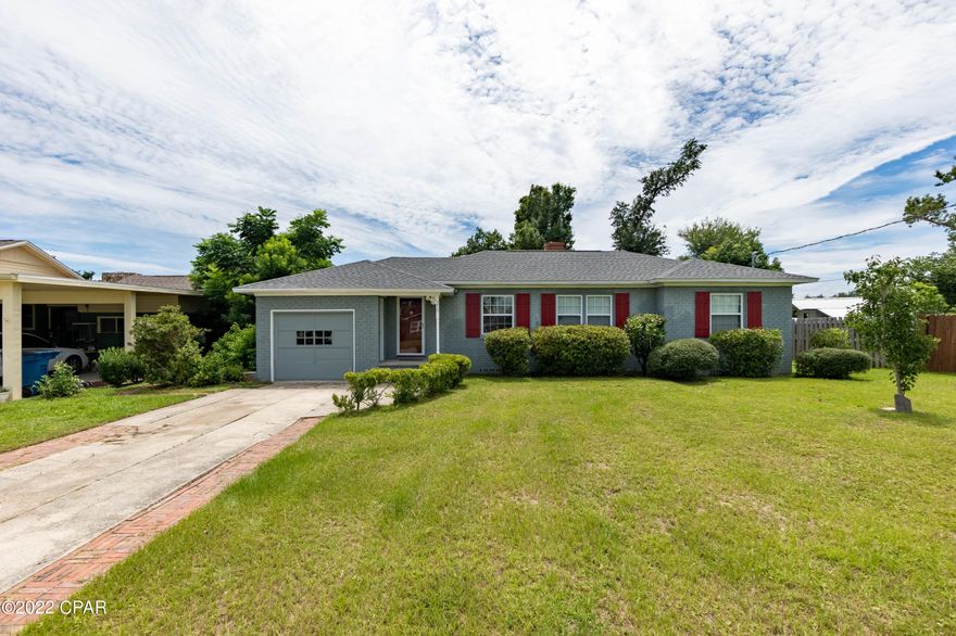 Charming 3/1 home in the highly desirable Cove neighborhood. This home offers a new roof, refinished beautiful a hardwood floors. double paned windows and so much more.  This home has been well maintained and some recent improvements include replacement of the AC, exterior freshly painted, sewer replaced, all new plumbing and newer washer and dryer and washer.  Home has a nice size living and dining room and a wonderful sunroom complete with a cozy woodburning fireplace, kitchen has plenty of counter and cabinet space and overlooks the back yard offering plenty of natural light.  Just minutes the Historical Downtown District which offers fantastic restaurants, shopping, a public boat ramp, and is a very walkable area full of charm.  Call for your private showing today. All ages, sizes including sq. ft. are approximate measure if important.