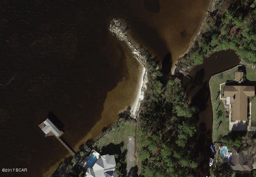 Beautiful waterfront lot with Bay access. Approximately 0.711 of an acre. Convenient to shops and schools in Lynn Haven area. The perfect lot to build that waterfront home you've always wanted. Property does have public water system access.