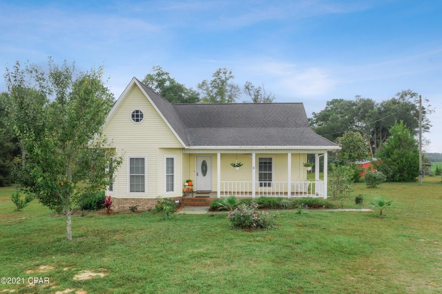 HUGE Price improvement!!!This lovely meticulously maintained 3-bedroom, 2 bath, 1,974 sq ft home sitting on top of a hill with a winding driveway overlooking pastures on 5 beautiful acres located in the highly desirable Piney Grove area. Take in stunning sunrise/sunset views from the large front porch. This spacious home features an eat-in kitchen with bay windows, breakfast bar and a brand-new large stainless-steel top of the line refrigerator, oversized living room with woodburning fireplace and large airconditioned Florida room with an abundance of windows ushering in lots of natural light. The grand master suite boasts double sinks with makeup vanity and walk-in close. Laundry room with oversized brand-new washer and dryer and new laundry room cabinets. Among other upgrade mentions are new lights and ceiling fans throughout the home, brand-new LVP flooring throughout the home including brand new carpet in bedrooms, all popcorn ceiling throughout the home was removed and all walls/ceilings were freshly painted, brushed nickel handles on all doors (including keyless entry handles placed on front and back doors), and a brand-new 16 seer 3 ton ac/heat pump with variable speed fan and all new ductwork was installed.

Property has 40x32 horse barn with stalls, 32x16 workshop with lean-to. Also, a brand new 24x13 out building was placed.  The building has electricity, a 30-amp hook up for RV installed and plenty of room to park a large RV.   The building also has an additional washer and dryer with an on-demand water heater and a large wash sink.

Property is located directly off Piney Grove Road from Hwy 77.  The gorgeous home is only minutes from Interstate 10 and convenience of grocery shopping and the Chipley hospital.  The Panama City Beach and Panama City are just 45 minutes away where you can enjoy the white sandy beaches of Florida's Emerald Gulf Coast, fine dining shopping and plenty of recreation awaits!