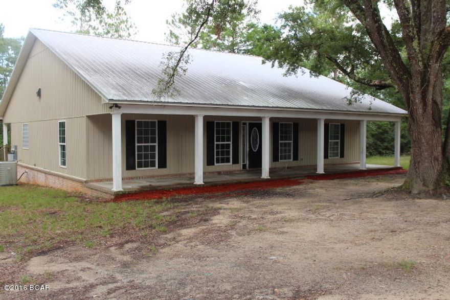 PRICE REDUCED!! Have you been looking for a newer home in the country on 20 acres? Look no more, here it is! The house has nice features that include a large living room with a fireplace, a split bedroom design with large master bath. The other two bedrooms have a Jack & Jill bath. There is a front porch and back porch that extends the entire width of the house. The grounds are wooded with all types of native trees.  Area is quiet and secluded.