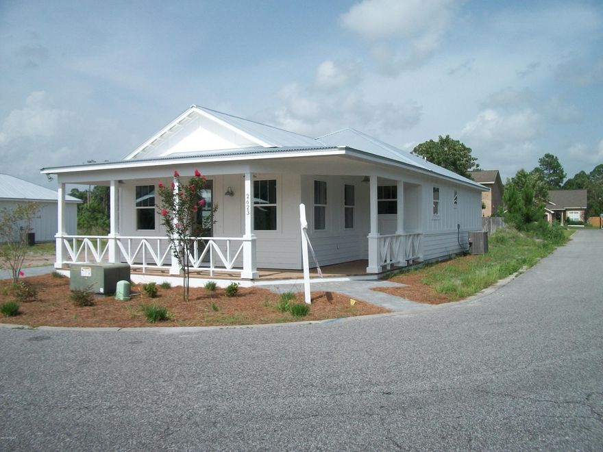 Architecturally designed by Place Alliance, International town planners and Architects, 2 bedroom, 2 bath, Coastal Cottage, centrally located in Lynn Haven, Florida. Well-appointed fixtures and finishes assembled by Baker Designs. This home has true Galvalume Metal Roofing, a deep wrap around front and side porch and board and batten siding. The community is architecturally controlled to maintain the Coastal Cottage appearance throughout the community. Home includes vinyl planking, solid surface counters, tile shower and bathroom flooring, shaker cabinets, high ceilings, ceiling fans, retro appliances, plumbing and lighting. The one car garage is to the rear of the house. Privacy fence, sod and irrigation system included with acceptable offer. Experience the quality and design of ''Th Willows.'' Construction will be complete May 30, 2015.