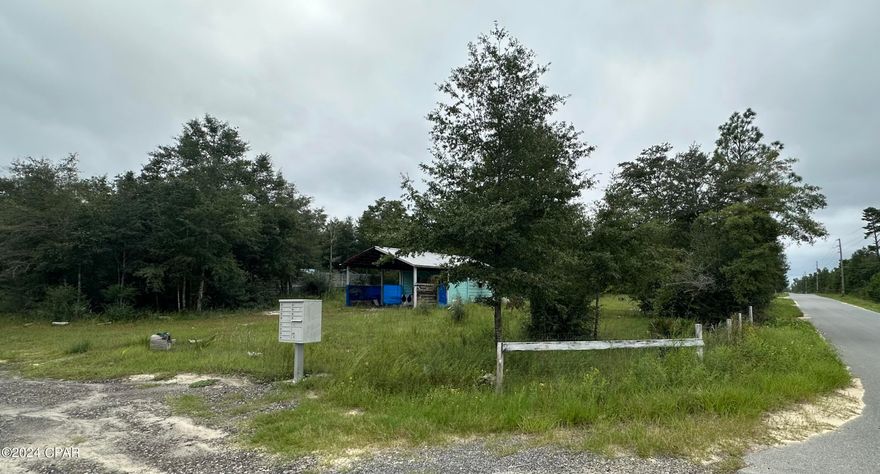 Nearly 1 Acre located on a paved road in Fountain, this lot could be the ideal spot for your home in the country.  The property once held a mobile home that was storm-damaged and has been removed.  However, many of the improvements remain:  well, septic, electric, and a pole barn with a workshop. Priced to sell quickly, being sold AS-IS/Where Is.  Workshop may not be used as a dwelling without further permitting. Call today!