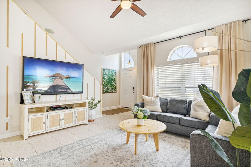 CURRENTLY UNDER CONTRACT, SELLER WILL CONSIDER BACKUP OFFERS. Wonderfully maintained freshly painted and fully furnished 3Bd 2.5Ba 1,432 SqFt townhouse in the ever-popular and gated Palm Cove community. Being on Short-term rent program this home generated over $58k in 2022 and over $50k in 2023. Long-term rent  potential estimated around $36k per year. The kitchen is equipped with SS appliances and open to the dining area and living room. Master bedroom is spacious and located on first level. No carpet: tile on first floor and modern LVP flooring on the second level.  Tastefully decorated three bedrooms accommodate up to 10 people. Laundry room is equipped with full size washer and dryer. Newer HVAC (2021) and water heater. The complex boasts two swimming pools, playground and after dark security guard. Low HOA only $167 per month also cover trash pick up and yard work. This property is minutes to the beach, college, Pier park, navy base, Publix sports park, restaurants, county pier & Ship Wreck Island water park & more! Perfect as a primary residence, vacation home or as investment property!