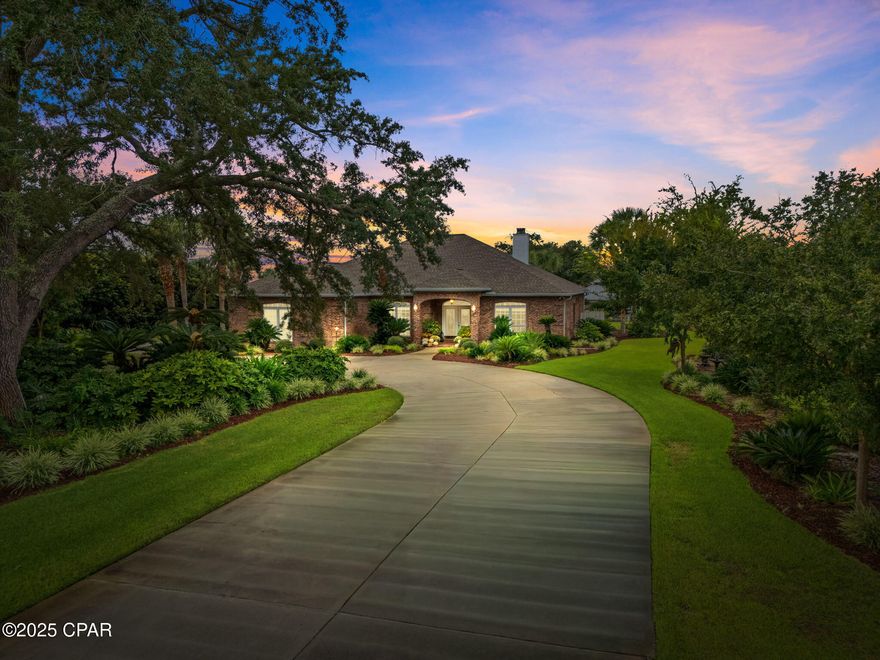 Tucked away beneath a canopy of mature oaks and surrounded by lush, manicured gardens, 6407 Highway 2311 is more than a home. This stunning brick estate captures the essence of Southern hospitality with its timeless design, thoughtful details, and seamless blend of indoor comfort and outdoor living. Featuring over 3400 square feet of living space, every inch of this residence has been crafted with purpose and care. The circular drive winds through the landscaped front yard to welcoming double French doors with decorative glass. Step inside and you are greeted by high ceilings, elegant columns, and an airy layout that feels both grand and inviting.

The main living area is centered around the open concept kitchen, which flows effortlessly into the family room with a fireplace and custom built ins. The kitchen combines style and function with a breakfast bar and a casual dining room overlooking the pool, gardens, and the peaceful natural backdrop beyond. The space offers a seamless connection to the formal dining and sitting rooms, creating a layout ideal for hosting gatherings both large and small. The primary suite serves as a peaceful retreat with French doors opening to the lanai. The spa inspired bath features a soaking tub, separate shower, dual sinks, a separate built in vanity, a spacious walk in closet, and a private water closet. Throughout the home, you will find elegant craftsmanship, crown molding, tile floors, and a whole home speaker system that enhances every living space. A large laundry and mud room connects directly to the attached garage for added convenience. The detached guest suite is equally impressive. Complete with its own full kitchen, dining area, living room, full bath, and an attached two car garage, it offers exceptional flexibility. Whether you are hosting guests, entertaining groups, or seeking a private living space separate from the main residence, this suite can easily adapt to fit your needs. Out back, the property transforms into a private outdoor paradise. The sparkling pool and spa are framed by tropical landscaping, multiple lounge areas, and a firepit. French doors from both the primary suite and the guest suite open to the covered lanai, creating an effortless connection between indoor and outdoor living. Beyond the pool, an inviting outdoor kitchen with a built in bar sits beneath a rustic pavilion, perfect for entertaining or relaxing on a quiet evening. For those who appreciate space for hobbies or hands on projects, the property includes a detached two bay workshop with one side designed for woodworking and the other for automotive use. There is also a charming She Shed building that serves as a creative space for crafting or home projects, with an attached storage area ideal for gardening tools or pool supplies. Just beyond, the greenhouse and potting area offer even more possibilities. Outfitted with a stainless sink and table, this area can easily transform into an outdoorsman's retreat, complete with a fish or game cleaning station, an outdoor washing machine, and ample space for storing gear, tools, and equipment. Whether tending plants or preparing for a day on the water, every detail of this property has been designed to blend comfort, creativity, and purpose. Located in the desirable Highpoint area, this property offers both privacy and convenience. Just a short drive from the white sand beaches of Panama City Beach, it also sits near the Highpoint Boat Landing. Ideal for boating, kayaking, and fishing on Deer Point Lake. Outdoor enthusiasts will love the proximity to local nature parks and trails, while frequent travelers will appreciate being within 20 miles of Northwest Florida Beaches International Airport.Tyndall Air Force Base and Naval Support Activity Panama City are also within 20 miles, making this location as practical as it is picturesque. Call a REALTOR today to schedule a private tour.