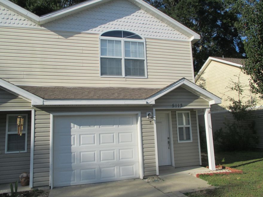 VERY WELL MAINTAINED TWO-STORY TOWNHOME CLOSE TO TYNDALL AFB.  This home features a first floor with a combination kitchen and living area with ceramic tile flooring, matching appliances (with new microwave range hood) and a half bath.  On the second floor a generous landing leads to a spacious Master bedroom and adjoining Master bath, two additional bedrooms and a full bath.  This is an end unit and one of the few units with a side yard.  All measurements are approximate.