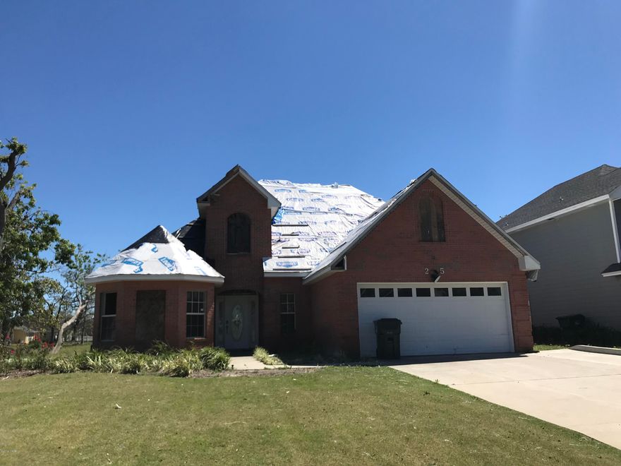 Brick PCC home located on the 6th hole .  Hurricane damage depicted in photos.  Sold AS IS.  Home featured a ground level consisting of family room with fireplace, large kitchen, breakfast nook, and large master suite.  Upstairs featured additional bedrooms and a bonus room.
