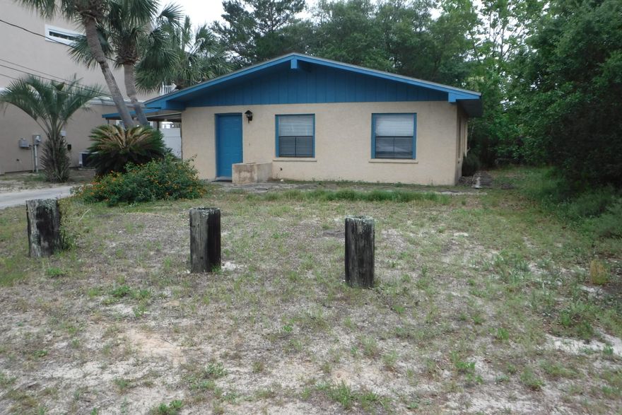 This charming 1 bedroom with bonus room that could be made into another small bedroom or office, 1 bath house is located within walking distance to the beach and has just been remodeled within the last few years. The kitchen is galley style with stainless steel appliances include refrigerator, stove, dishwasher and on the counter microwave. Floors are ceramic tile throughout kitchen, living room area & bedrooms. There is a storage unit behind home with washer and dryer hookups, along with good storage area for bikes, beach supplies, etc. Nice open deck area outside of kitchen for outside entertaining and enjoyment.  No Pets Allowed.