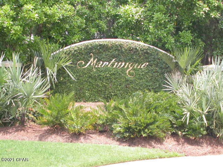 Great corner lot in Martinique gated community.  Cleared and ready to build. Room for side entry garage. The pool and park pavilion overlook the main lake of Martinique. The gated cobblestone entrance provides security for residents and their guests. The scenic walking trail wraps and intermingles throughout the community. Martinique is a first class community! Building and landscaping standards are designed to make the most of the extraordinary location. If you enjoy boating and nature, you will love Martinique!