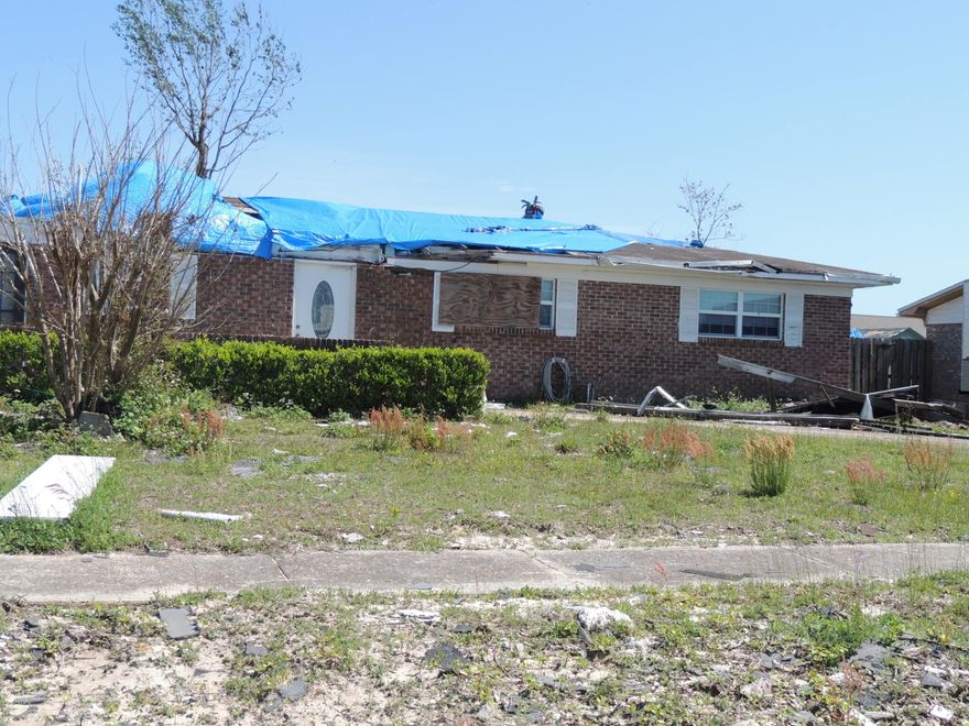 Age, sq ft, Lot & room sizes are approximate.  Hurricane Michael damaged home,  Sold ''as is'' condition.  Needs roof, has water damage.  Workshop in back yard.  Convenient neighborhood, Close to Tyndall AFB