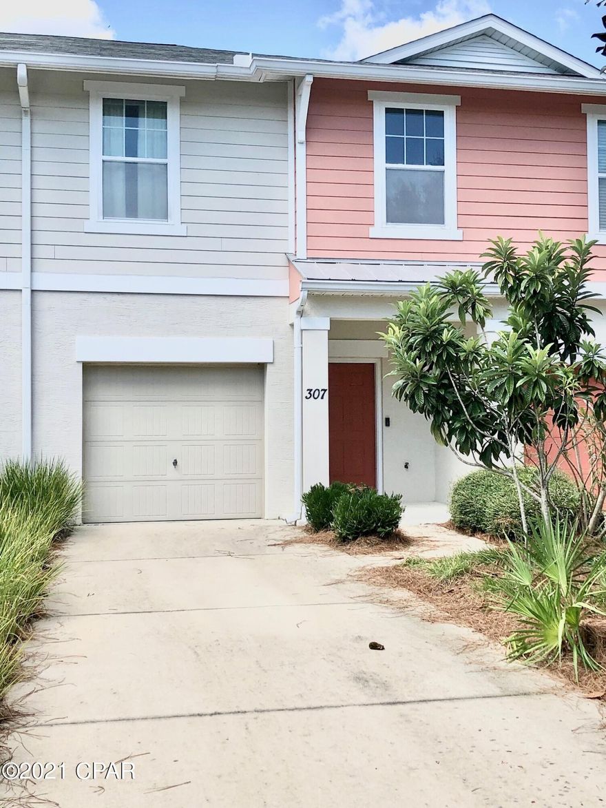 Super townhome located in beautiful Whisper Dunes community! Maintenance free living in this 3 bedroom and 2.5 bath townhome. Spacious open Great room with dining area, SS appliances, tile floors down and in bathrooms, carpet in bedrooms. Maple cabinets in the open kitchen where you have a view of the back yard and patio. Washer/dryer included and located on 2nd floor with bedrooms. First floor is built of block for storm safety, one car garage, community pool and yard maintenance covered in the HOA fee. Golf cart ride to the beach and its not far to Pier Park. Peace and quiet never felt so good! All measurements are approximate and should be checked by Buyer.