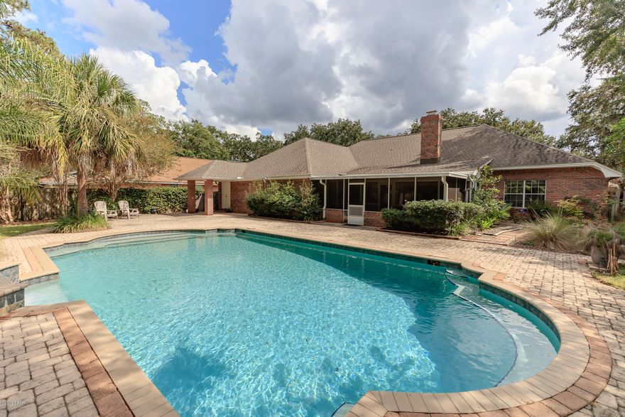 STUNNING 4 BEDROOM HOME ON QUITE CUL-DE-SAC IN THE HEART OF LYNN HAVEN!  THIS HOUSE IS NESTLED AMONG MATURE OAKS, LARGE PALM TREES AND LUSH PROFESSIONAL LANDSCAPING. THE BACK YARD IS ANY HOME OWNERS DELIGHT FEATURING A CUSTOM 20X40 GUNITE POOL WITH WATERFALL FEATURE, PAVERED PATIO AND SCREENED BACK PORCH. INTERIOR FEATURES INCLUDE LARGE FORMAL DINING ROOM, SPACIOUS OPEN KITCHEN WITH SOLID SURFACE COUNTER TOPS, BREAKFAST BAR, WET BAR,  2 REFRIGERATORS,BREAKFAST AREA AND  BUILT IN NOOK FOR DESK. THE LIVING ROOM OFFERS WOOD FLOORS AND A WOOD BURNING FIREPLACE. IT CONNECTS FROM THE KITCHEN OR FOYER MAKING THIS A GREAT SPACE FOR ENTERTAINING! OFF THE KITCHEN YOU WILL FIND THE SPACIOUS MASTER SUITE WITH REAR PATIO ACCESS, LARGE WALK IN CLOSET, SEPARATE TUB AND SHOWER AND  DOUBLE VANITIES. ADDITIONAL FEATURES INCLUDE 3 ADDITIONAL BEDROOMS, 2 ADDITIONAL FULL BATHROOMS, TONS OF STORAGE. *this home had minor storm damage... seller is in the process of replacing the roof and making necessary storm related repairs.