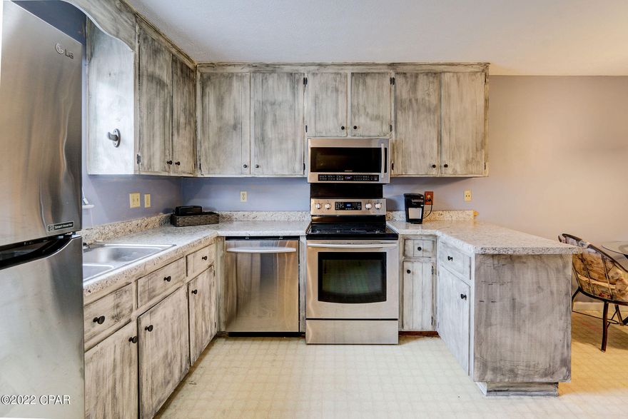 CURRENTLY UNDER CONTRACT-SELLER ACCEPTING BACKUP OFFERS.  This two bedroom townhome will  make a great rental or residence.  One block the to the beach. Located on the West end near Pier Park.  This unit has two bedrooms and bath up stairs with balcony.    Kitchen has new appliances. Full size Washer and dryer.  and a 1/2 bath down stairs.   Sleeps 6-8.  Home has new roof.   Small back yard with storage closet. Located near shopping, dinning, and entertainment.