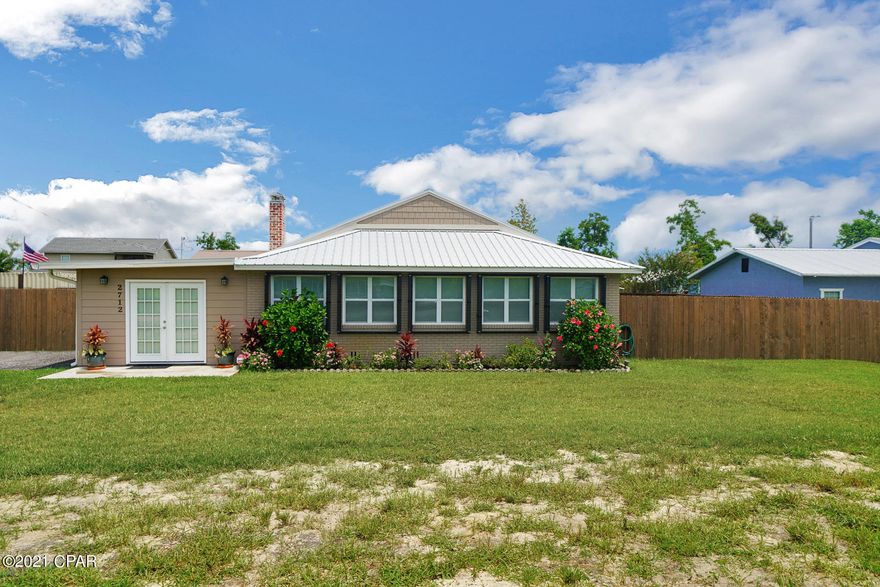 This home was completely updated in 2019 and forward to date. The highlighted updates consists of Whole home generator, sprinkler system,Spray foam insulation in main home and Mother-in-law suite,  deep well, hurricane shutters, new windows, new metal roof for main house and mother-in-law suite (720) Sq Ft. Home contains a sound proof bonus room with full bar and sound proof. Great for entertaining family and friends! This home has a very open floor plan that is great for entertaining family and events. This is a must see home if you are looking for a completely turn key home, that's move in ready and total heated and cooled living space is 2292 Sq Ft with 3 bedrooms and 3 baths!