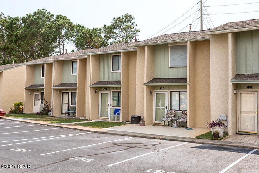 Beautiful 2 bedroom/1.5 bathroom townhome in sought after Gulf Highlands Beach Resort! Recently painted with hardwood and tile throughout - no carpet! Master bedroom upstairs has TWO closets instead of one. Roof is 2 years old. Step out on to the back patio or balcony and enjoy plenty of space! You can pull right up to your front door with two designated parking spaces- no elevators or parking garages. Unit has never been rented, but is in a great location to be a vacation rental! Gulf Highlands has great amenities for guests - including swimming pools, tennis courts, and shuffleboard courts.