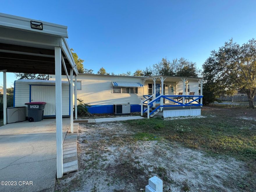 CASH OR OWNER FINANCING AVAILABLE! Excellent Primary or Short Term Rental! Updated and completely   renovated double wide includes all new furnishings, new kitchen cabinetry &  countertops, all new appliances, new flooring and new light fixtures throughout!! This 3 bedroom/2 bathroom home is located on a cul-de-sac in the quiet neighborhood of North Lagoon Oaks in Panama City Beach! This home features a large open floor plan, a large  backyard, a covered front porch and a carport ! No HOA! Close to the Beach, shopping, nightlife, Navy Base and the Lagoon!  Just bring your clothes and relax as this home needs nothing!  All information and measurements are approximate and should be verified by buyer if important. Seller is a Florida Licensed Real Estate Agent.