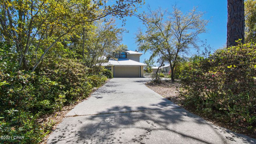 Spacious contemporary with an incredible lot located on a quiet cul de sac  minutes from all the action! It feels secluded but you are only minutes from St Andrews STATE PARK, great restaurants, the Navy Base and the white sandy BEACHES. Inside this striking home, you'll find loads of natural light and great architectural features. The Great Room offers space for spreading out, a wood burning fireplace and glass doors leading out to a screened porch. The kitchen is located conveniently off the living and dining areas and has nice wood cabinetry and a breakfast bar. 3 spacious bedrooms are located on the second floor with a private master suite plus a very large guest bedroom. The outside has mature landscaping, 2 outbuilding and large deck space for entertaining. No HOA's!