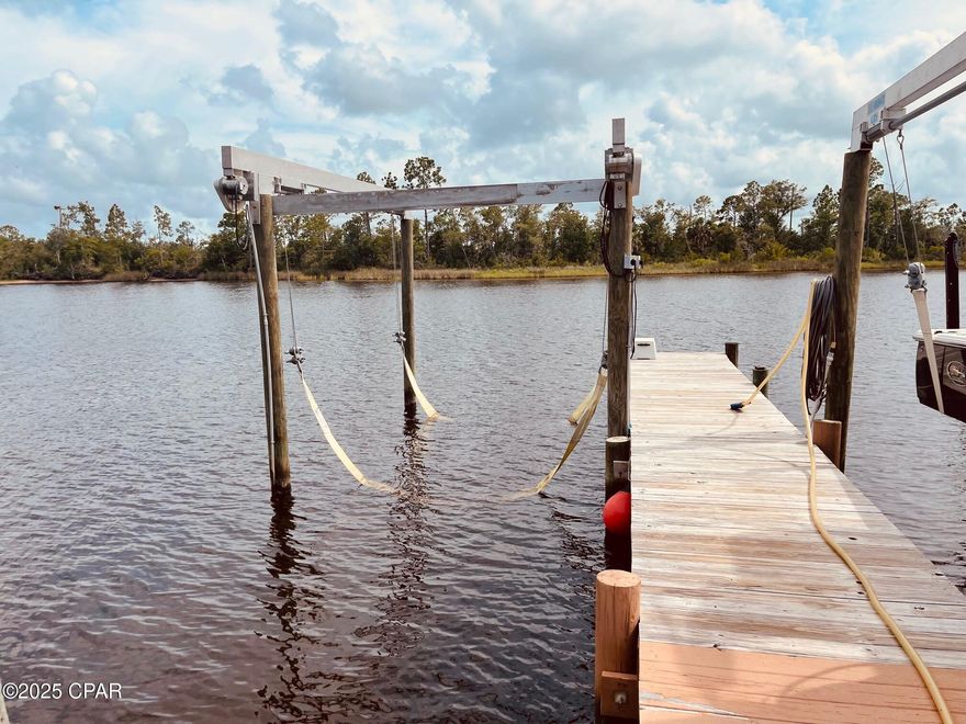 For Rent: The boat lift can accommodate up to a 32' boat.  16000lb boat lift.  NO ONE LIVES ON PROPERTY.  No house.