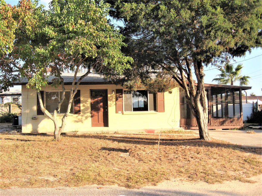 LARGE TWO LOTS with adorable cottage in desirable Laguna Beach. Two bedroom and one bath . Large screened porch.CONCRETE block home, two blocks from the beach! Wonderful investment potential. Original terrazzo floors.