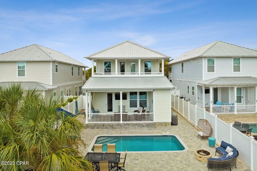 Taking Backups the phrase 'CURRENTLY UNDER CONTRACT, SELLER WILL CONSIDER BACKUP OFFERS' must be placed at the beginning of the Public Remarks. Fully Furnished! Seller will pay $2000 toward buyers closing cost! Home warranty included! Beautiful beach style home in the much desired West End of Laguna Beach! Located only steps to the emerald waters of the Gulf of Mexico. With the allowance of short term rentals this house a terrific investment opportunity! Great location, near Pier Park shopping, restaurants, 30A, and the airport. The homes feature metal roofs, hardie board siding, double French doors, high impact/hurricane windows and doors, paver driveways, outdoor shower, tankless gas water heaters and gas ranges, with a lock-out storage room that is heated and cooled. Enjoy the custom built Cox pool on these hot days. 

You will enjoy many upgrades included  quartz kitchen counter tops, stainless appliances, and eight foot doors. Exhibits an open floor plan, with one master suite on the first floor and a second one on the second floor. Ten foot ceilings and beautiful coastal wood trim adorn the windows and doors, as well as 11ft boxed ceilings. Two full baths, a master bedroom , two additional bedrooms, and a full tiled balcony located on the second floor. Many areas of spacious, open sitting area to just relax or entertain including a nice paver pool deck. Don't miss the putting green located in the privacy fenced backyard. This house has it all. Don't this opportunity!