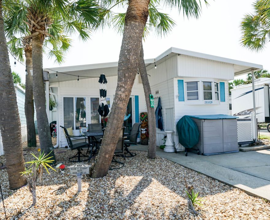 Check out this adorable Venture Out home! This 2 bedroom 1.5 bath home is super charming and move in ready!  Fantastic front porch and with nice shade perfect for relaxing after a long day at the beach! New HVAC system added recently. Great for investment or make this your second home. Venture Out is a golf cart community that has exploded with popularity recently... With 300' on the beautiful pristine beaches of the Gulf of Mexico and 1,000' on the Grand Lagoon. Venture Out has something for everyone. With 2 pools, fishing pier, boat ramp, mini golf, children's play ground and much much more!