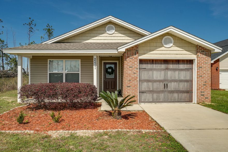 Adorable Florida cottage with a 1 car garage on an end lot near the end of a cul de sac. This new 3-bedroom, 2 bath home has an open floor plan with large living areas. As you enter the home, you step into the inviting foyer featuring tile floors that run throughout the main living areas. The kitchen is well appointed with wood cabinets, a large island/breakfast bar overlooking the dining area, and a desk area workstation. The living area includes French door access to the back patio and fenced backyard, great for gatherings and barbecues. Master suite includes private bath, walk-in closets. 2 additional bedrooms and a bath are separate from the master allowing for maximum privacy.  This lot is huge- much larger than the fenced area. Quiet Oaks Dr. is a quiet dead-end street with little traffic centrally located off Transmitter Rd. It's close to shopping, restaurants, schools, and less than 20 minutes to Tyndall Air Force Base. All dimensions are approximate and should be verified by buyer if important.