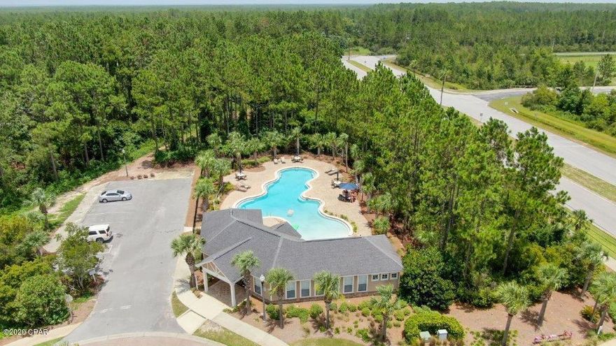 CURRENTLY UNDER CONTRACT, SELLER ACCEPTING BACKUP OFFERS. THE BEACH IS CALLING! This newly built townhouse is nestled back in a tiny community, close to all PCB has to offer: pristine beaches, fantastic shopping, and kid-friendly attractions. And it backs up to the pond! Boasting 10' ceilings downstairs and 9' ceiling upstairs, along with large living and kitchen areas, you'll never want for space! The kitchen comes with stainless steel appliances including a refrigerator, smooth top range, and a dishwasher. The huge master suite houses a large walk in closet, separate garden tub and a beautifully tiled walk in shower. This is the only one available with GREEN space in the back and located on a pond and close to the additional parking lot in the back.