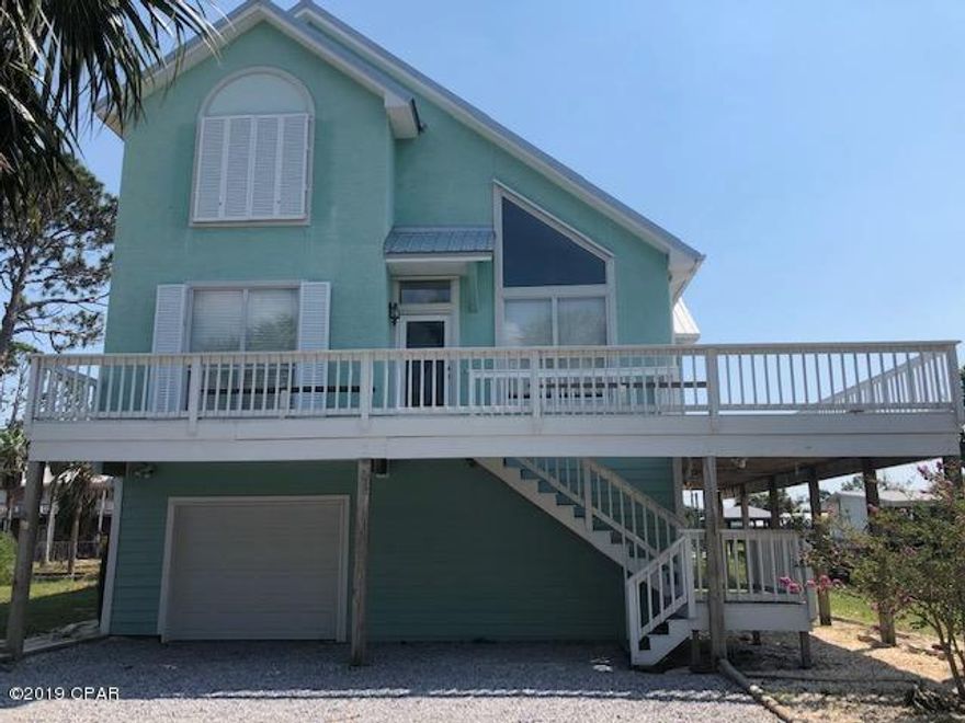 Beautiful Waterfront 3 bedroom/2.5 bath home overlooking North Bay complete with a dock. Open, airy with beautiful views of the bay. Freshly painted and newly installed Luxury Vinyl Plank flooring. Large wrap around deck. Great for entertaining. Master suite has vaulted ceilings, access to deck, garden tub, separate shower, double vanity and double closets. Loads of storage with garage and workshop on ground level.