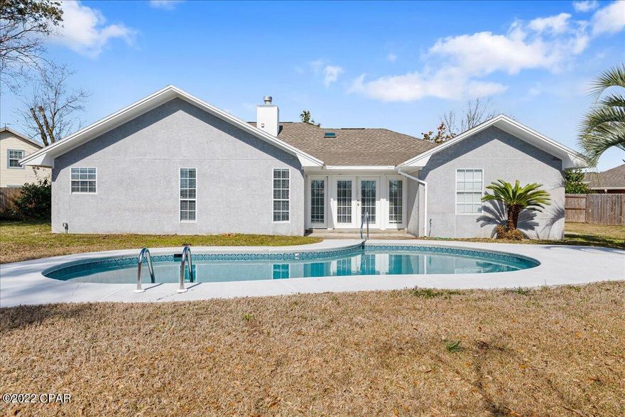 CURRENTLY UNDER CONTRACT, SELLER ACCEPTING BACKUP OFFERS Welcome to your beautiful 4 Bed, 2 Bath home, with in-ground pool, located in the highly desired area of Northshore in Panama City, FL! You'll love this home's open, split-bedroom floor plan, with plenty of space for everyone, and includes a sunroom, a great room, a family room, a separate dining room, a breakfast nook off the kitchen, and ample closets for storage.  This home features tray and cathedral ceilings throughout, three (3) skylights, as well as a double sided fireplace, which can be viewed from both the living room and the great room. The kitchen features a breakfast area, new granite countertops and new cabinets, as well as a separate dining room off of the living room. The primary bedroom suite features a large walk-in closet, and views of the beautiful fenced-in backyard and in-ground pool. The primary bathroom suite features granite countertops, double vanities, an oversized whirlpool jacuzzi tub with separate shower. Updates include new carpet in all the bedrooms, new Luxury vinyl plank flooring in the main living area, and the HVAC was replaced in 2019. This home is on a large, almost .4 acre lot, on a highly sought after cul-de-sac, offering both privacy and safety. Seller to credit buyer at closing for costs associated with purchasing new appliances and/or seller to purchase new appliances before closing. This one won't last long! Call today to schedule your private showing and see this lovely home in person!