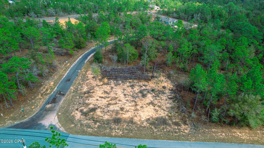 Corner lot available in the growing Sunny Hills community. This approximately 0.36-acre property offers a quiet setting with paved road access and plenty of space to build. Located just a short drive from Panama City, you get the balance of peaceful surroundings while still being within reach of shopping, dining, and the Gulf Coast. With new construction happening throughout the area, now is a great opportunity to secure land in a developing neighborhood. Cash offers only.