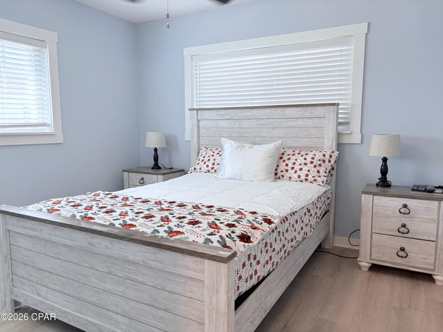 Enjoy the best of coastal living in this beautifully maintained ground-floor condo at Landmark on St. Andrews Bay. This 2-bedroom, 1-bath residence features a bright, open floor plan that effortlessly blends comfort and style, making it perfect for both everyday living and entertaining. Unit W101 offers a serene courtyard-facing location and a light-filled interior where the living space flows seamlessly into the dining and kitchen areas.

The thoughtfully designed kitchen is well equipped, and the unit includes its own washer and dryer for added convenience, while luxury vinyl plank flooring enhances the home's modern appeal and durability. The primary bedroom offers a spacious walk-in closet providing excellent storage, while an additional exterior storage closet just outside the kitchen door provides even more functionality

Residents enjoy stunning bay views along with an exceptional selection of resort-style amenities, including a private beach, two swimming pools, fitness center, marina, clubhouse, community dock with rental boat slips, grilling areas, scenic walkways, and expansive green spaces overlooking the bay. HOA dues include water, trash, cable, and WiFi.

Located within walking distance of historic St. Andrews, this condo offers easy access to the bayfront marina, local shops, and popular dining spots. Downtown Panama City is just a short drive away, featuring an exciting mix of restaurants, shopping, and recreational activities. Ideal as a primary residence, weekend escape, or investment property, this home truly captures the Florida coastal lifestyle.