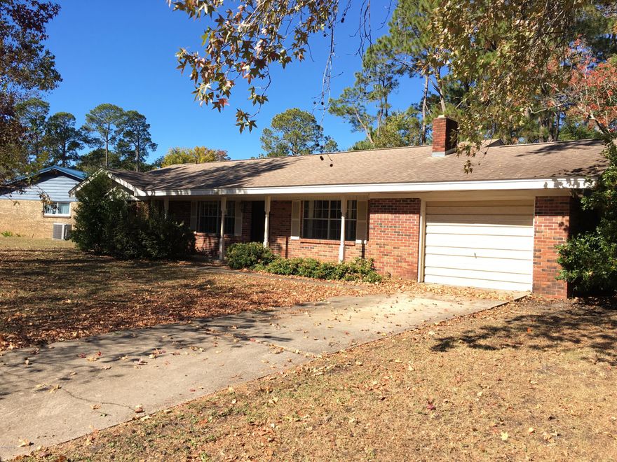 Beautiful setting for this ranch style brick home! The huge oversized lot is lined with trees and partially fenced. The wow factor is having both a huge great room area with a fireplace and a formal living room.  The great room, dining area and kitchen are all in one huge open space. The ceiling to floor brick fireplace is the focal point of the living area. So much potential here for a beautiful home! Three bedrooms and 2 baths offer enough  space for most families. The large deck creates another living space outdoors. The home also offers a one car garage.