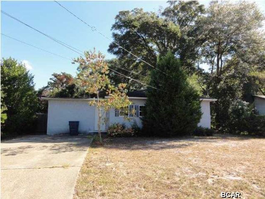 Cute ranch in desirable location! Convenient to beaches, Tyndall and town! Large, level fenced backyard with covered storage/workshop! Spacious kitchen with tons of cabinet storage and view to family room! Beautiful hardwoods in large bedrooms! Separate dining room! Don't miss out of this opportunity! Show and submit your offer today!