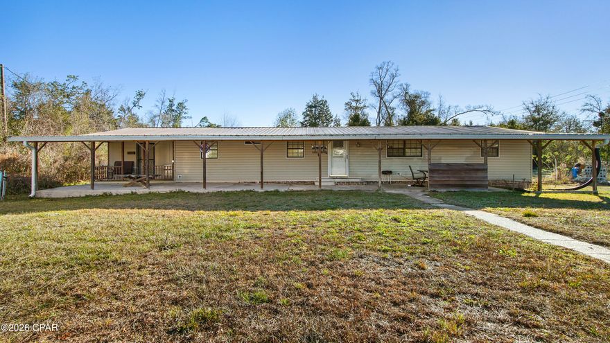 Great 4/3 open floor plan on a huge corner lot. Over 3/4 of an acre. Only about 20 mins to panama city beach. Full covered front patio. Partially fenced in yard. The front has privacy trees. New septic pump and well pump was installed in 2018. 20 X 20 shed in the back yard. Newl roof in 2019. All appliances are staying. One of the bedrooms has its own entrance making it a great MIL suite.
