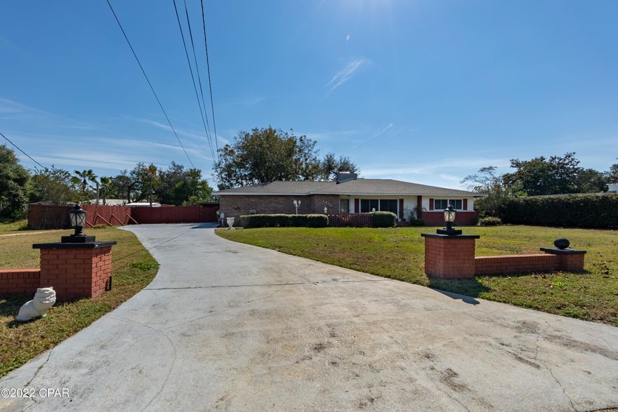 Large 3 bedroom 2 bath brick home situated on over 1/4 acre of land in the heart of Panama City just minutes from a newly opened boat landing/ramp.  This house has so much space to offer a large living/dining room with built in's to display pictures, etc., charming family room with a wood burning fireplace that opens to sunny and spacious bonus room with endless possibilities for it's use and all oversized bedrooms.   Nice kitchen with plenty of cabinet and counter space and even custom storage unit which folds out allowing for so much additional storage of can goods/spice.  Home has custom touches such as crown molding in every room, pocket doors, both baths have tile bath/shower, double vanities, solid service counter tops, chair railings and much more.  Call for your private show today.