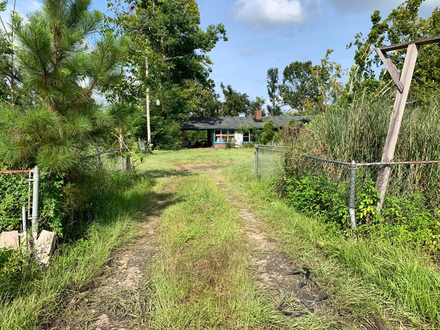 Ranch style brick home on 1.75 acres. The home aside from the living room has a large sun room and enclosed porch. the master bedroom is gigantic the property has much potential. It is situated on about 270 ft of Highway frontage on 71 and is mostly chain linked fenced in .