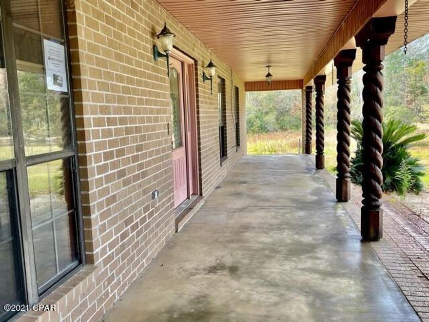 This is a lovely brick home in the country on approx. 6   acres.  There is part of a pond on the property.   The home has excellent features that include a large formal living room with fireplace, formal dining room, breakfast nook and kitchen that has all appliances.  The master suite is on the west wing of the house with large master bath.  The other 2 bedrooms and bath is on the east wing,   There is a large covered patio.   The horse barn has 8 stalls and 2 storage/tack rooms.

The 2 car garage has been closed in to make a large storage room and a den.