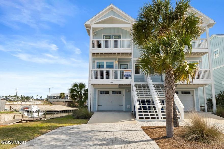 ATTENTION BOATERS AND FISHERMEN! CANAL FRONT, BEACHSIDE NEWLY BUILT TOWNHOME WITH COVERED BOAT SLIP! Don't miss this rare opportunity to own a canal-front property on the beachside of Hwy 98. This beautiful 3 BR/3.5 BA townhome with an additional bunk area is located a half block from the beach making it perfect for the fisherman and family! The townhome is beautifully furnished with high-end furniture, making it truly turnkey. Upon entry, you will notice the Coretec LVP that is throughout the main floor as well as the Wet bar featuring a beverage cooler and additional cabinet space. Making your way into the kitchen you will see the custom cabinets, granite countertops, and Bosch stainless steel appliances. The first floor features the garage, perfect for parking or storing fishing equipment and beach gear, and the first bedroom which is an ensuite with a tiled walk-in shower and access to a private porch overlooking the canal. The main floor features a kitchen with custom cabinets, granite countertops, and Bosch stainless steel appliances, a living room with a wet bar that holds a beverage fridge, a powder room, and the laundry room, which features a GE washer and dryer. The top floor features the master suite, with dual vanities, an oversized walk-in shower, and a private balcony perfect for watching the boats come by, an additional bedroom with its own bathroom and balcony with a GULF VIEW, and an additional bunk area, holding two twin-size built-in bunks. The amenities of the property include a personal covered boat slip with a 13,000 lb lift, great deck space, and a 13x15 garage. Being on the beach side eliminates the worry of having to go under the Hwy 98 bridge which is perfect for anyone with a tower. Don't miss this rare opportunity!