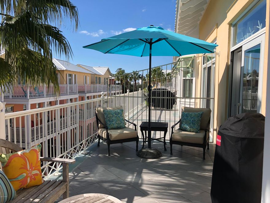 This well designed and beautifully decorated one bedroom condo in the Downtown area of Carillon Beach will not last! There is an open Living and Dining Room Floor plan with easy access to the kitchen, a half bath and a spacious balcony with views of Lake Carillon that make up the first floor. On the second floor, you will find a huge master bedroom and master bathroom with lake and gulf views! There is a new water heater, garbage disposal,  gas grill and other amenities including 2 years remaining on a 3 year Peaden HVAC and plumbing transferable contract, custom draperies and shades, sofa/sleeper, day bed and electronic deadbolt door lock.  There is also a golf cart being sold with the unit for you to use to enjoy all of the amenities at Carillon Beach!