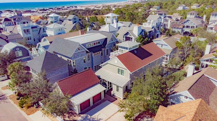 Seller entertaining all reasonable offers. 

 Revel in this fully furnished, turn-key, 4 Bedroom, 4.5 Bath masterpiece and embrace the lifestyle you have always dreamed of living in Watersound Beach!  This beautifully decorated luxury home offers a fabulous kitchen with a gas jenn air stove, center island and lots of cabinets, large spacious living room with fireplace, dining room, and master suite on main level.  Second level offers three chic bedrooms with private baths and a sitting area.  A third level level provides an entertaining bar and a balcony.  Extra features include large storage room, 20x9.6 screened porch,18.9x9.6 covered porch hardwood and marble floors, plantation shutters very good size laundry and a 3 car garage. This home is very CLOSE to the BEACH and waiting for you to enjoy.