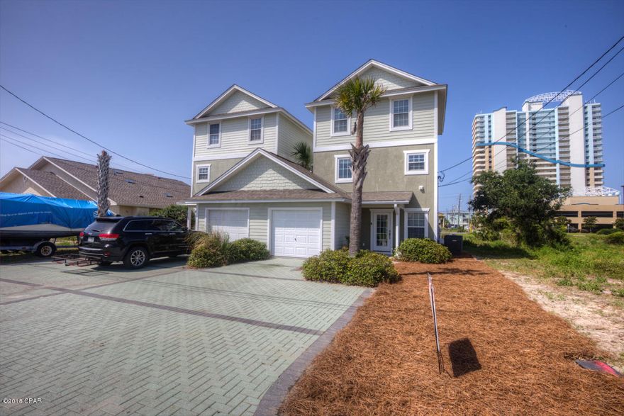 Owner financing possible on this three story home on the eastern most south side of Beach Drive, up by Schooners.On the outside of the home you have a false garage that is 12X10 which can hold alot of storage;  beach toys, etc. On the back side of the home is a second and third floor balcony facing the Gulf. Very limited Gulf views here but at the top of the home there is a shared crow's nest that allows plenty of Gulf views. This home has a LR on the first floor with access to the small backyard. This along with a fully stocked kitchen, dining area and half bath composes the first floor. The laundry room is on the second floor along with 2 bedrooms and a Jack and Jill bath between and the covered deck. Third floor is almost identical but with a larger master bedroom. With vacation rentals popular as they are now---small three sided privacy fence and a large hot tub in the backyard, your in business. Home is located a few blocks from St. Andrew State Park, Schooners, all the marinas, Captain Andersons and 20 minutes to Pier Park. Exterior of home is currently being painted and interior improvements and landscaping are also being done.