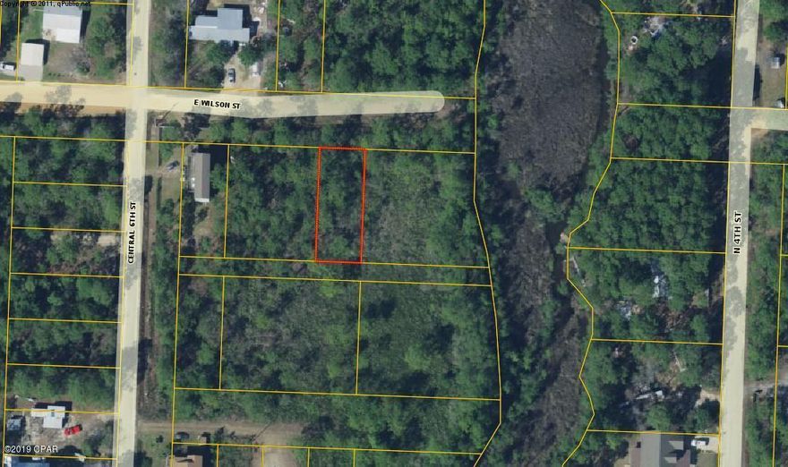 Great building lot in a quiet area off of Hwy 98. This lot is centrally located with an easy drive to Destin or Panama City Beach. The lot is zoned Residential Preservation and is in flood zone AE7. This lot contains wetlands and requires approval by EPA to build. Public Water and Sewer can be run from Central 6th Street. Also look at the adjoining MLS# 717775. Build your dream home today!