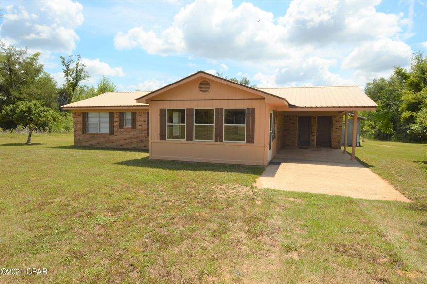 Adorable home ready for its new owner!  This three bedroom home features an open concept floor plan in the living area and a large sun room.  Home features one and a half baths. Under the carport there is a storage room, and the property has a 12x16 outbuilding.  Property features 5 acres!  This one is must see!