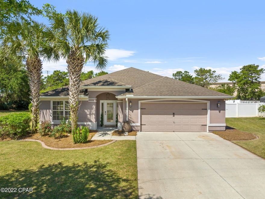 Palmetto Trace gem!  Don't miss this beautifully remodeled 3 bedroom, 2 bath house that includes an office and almost 500 sf Florida room.  From the moment you enter this home you will appreciate all of the care that was taken to make it a sanctuary.  From the shiplap foyer and wood look ceramic tile to the completely renovated kitchen that includes new cabinetry and a gorgeous large granite island, this home is made for entertaining.  There is a separate office and a large custom laundry room with lots of cabinetry and shelving for a variety of hobby or storage needs. The original laundry room is still intact but could support an additional or half bathroom.  The main living space contains the kitchen, dining space and living area.  The spacious Florida room is heated/cooled by a mini split.  It would make a great second living area, game room, man cave, etc.  The master bathroom has double vanities, walk in shower, soaking tub and large walk-in closet.  On the other side of the house are two guest bedrooms and a guest bath.  The yard is one of the largest in the neighborhood and has the advantage of having a double gate making it easy to store items in the yard behind the privacy fence.  There is a sprinkler system and the electric was upgraded to allow a pool or hot tub to be installed. There is an easement at the back of the property that backs up to Pier Park North.  The roof is original, AC is 2019 (inside and out). Their location in Palmetto Trace is near a cul de sac so it's a low traffic area.  There are two community pools for enjoyment.  HOA fees are $218 per quarter.  There is a 1/2% of sales price new buyer fee that has to be paid to the St. Joe Development Corporation at closing.  Close to Pier Park, Aaron Bessant Park, Frank Brown Park, the beaches, etc. it makes it a perfect location. Make plans to see this beautiful home today!