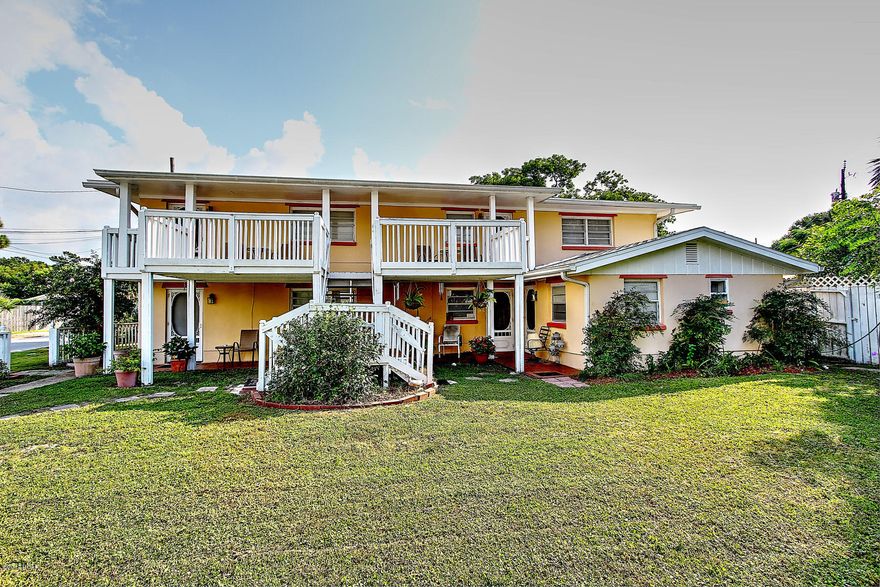 FINANACING FELL THROUGH! Bring offers! Great investment opportunity on this quadplex on 3 lots just one block from the worlds most beautiful beaches. Beach access is dedicated beach access. Excellent Vacation Rental cash flow potential. Rent out all 4 or live in the one larger unit and rent out the other 3. Consists of 4- two bedroom, one bath units with one unit having a 15x15 addition that has an extra bath and could be used as a third bedroom. All bathrooms have floor and wall tile. Units downstairs have terrazzo floors. Upstairs units have carpet with vinyl flooring in the kitchen. Sewer available and two outbuildings on the third lot. All information is believed to be accurate and correct; buyer to confirm & verify if important.