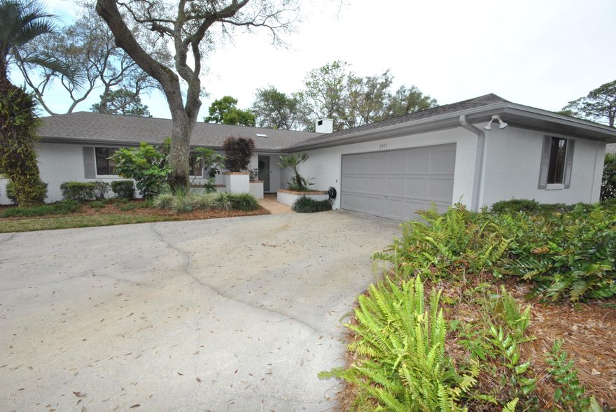 Pretty Bayou, waterfront, boathouse with lift, 4 bedrooms, 2 car garage, fireplace, over 2700 square feet and priced under $127 a square foot - for WATERFRONT! Come visit 2445 Pretty Bayou Blvd, a four bedroom and two bath waterfront home. Features - manicured lawn and landscape, magnolia and oak trees, peace and quiet, new paint on the exterior and new roof. Open floor plan, high ceilings in the living area, kitchen dining and family room and fireplace are designed for family and  entertaining. The home has as additional family room or game room and a 12x20 office. Waterfront living, fully functional boat house and minutes to the bay, gulf and Shell Island. Come visit today!