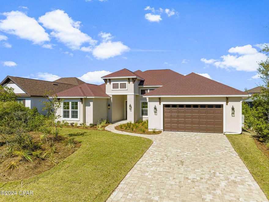 Stunning brand new home in the beautiful, upscale, gated community of Preserve on the Bay, in the heart of Panama City Beach. This one of a kind home features 2,864 sq. ft. of luxury living with an inviting open floor plan, which comprises 4 bedrooms and 4 full baths. As you enter the home you are immediately greeted with quality and class, 10' ceilings throughout, beautiful hardwood floors, a large living area with extensive use of windows overlooking the professionally landscaped back yard and natural preserve area(with plenty of room for a pool). The formal dining room with a 12' high tray ceiling, wood flooring throughout the main areas and Master Bedroom, extensive use of trim, granite counter tops, and 8' doors are just some of the other exquisite features of this home. For the cooking enthusiast, the large open plan Kitchen features stainless steel appliances(which includes a natural gas cooktop, wall oven, french door refrigerator, microwave, and dishwasher), a walk-in pantry, an oversized island incorporating a breakfast bar, in addition to a separate breakfast room with plenty of windows overlooking the back yard and allowing natural light to filter into the kitchen.

The Master Suite wing features an oversized bedroom, divided walk-in closet, two separate vanity sinks, a free standing soaking garden tub, and a large beautiful separate tiled glass enclosed shower. This is a highly energy efficient and well constructed home utilizing 2"x6" framing which allows for enhanced insulation values, as well as double paned low-E windows. The home is also backed with the peace of mind of a Home Warranty. All dimensions are approximate, please measure and verify for accuracy.